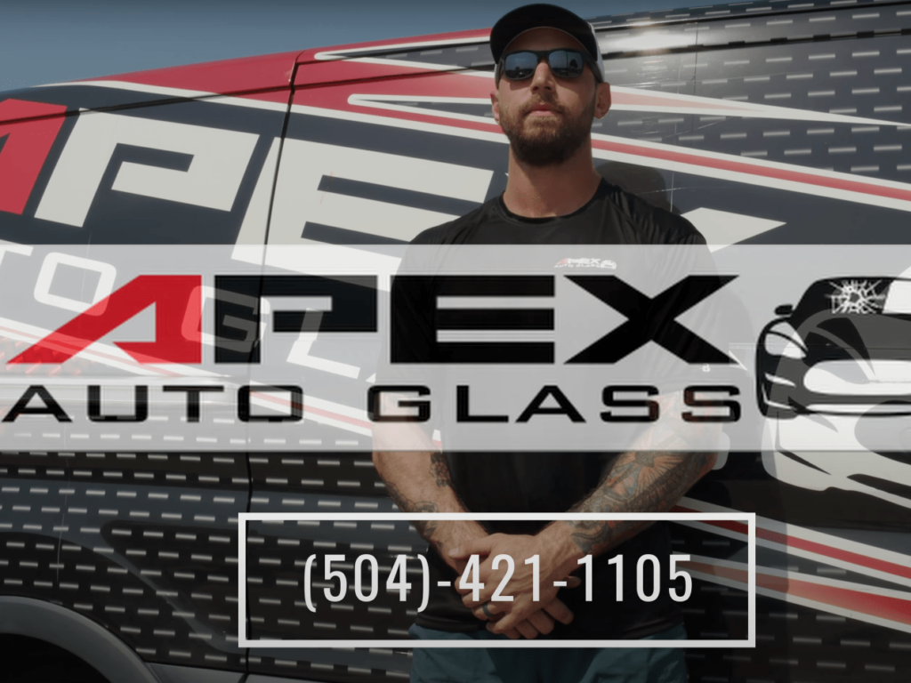 Apex Auto Glass technician with logo and phone number - Making Auto Glass Replacement Hassle-Free in New Orleans