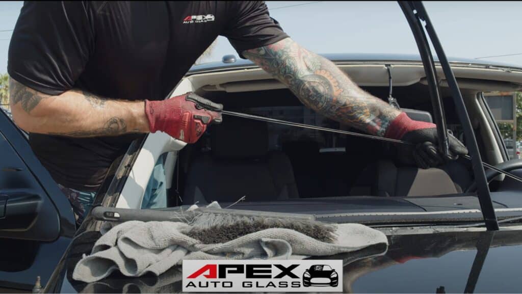 Technician repairing a windshield. Windshield repair in new orleans