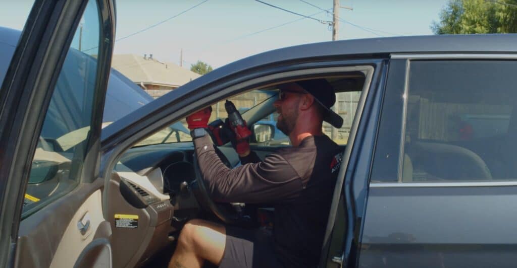 5 Signs You Need to Replace Your Windshield Immediately, apex auto glass technician replacing a windshield