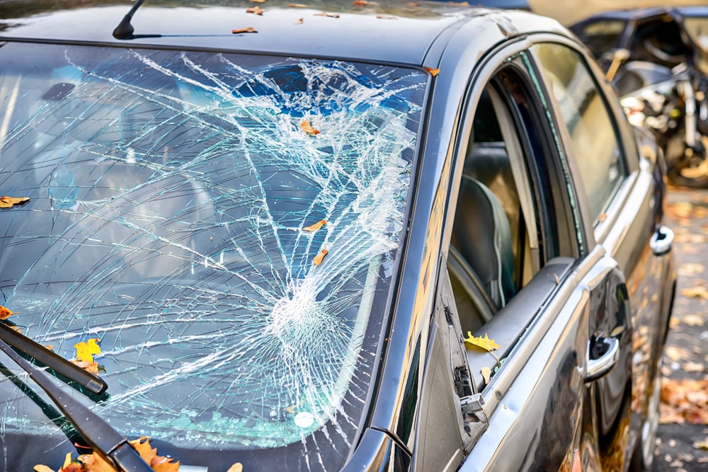Image symbolizing vandalism with shattered and broken auto glass. New Orleans windshield repair