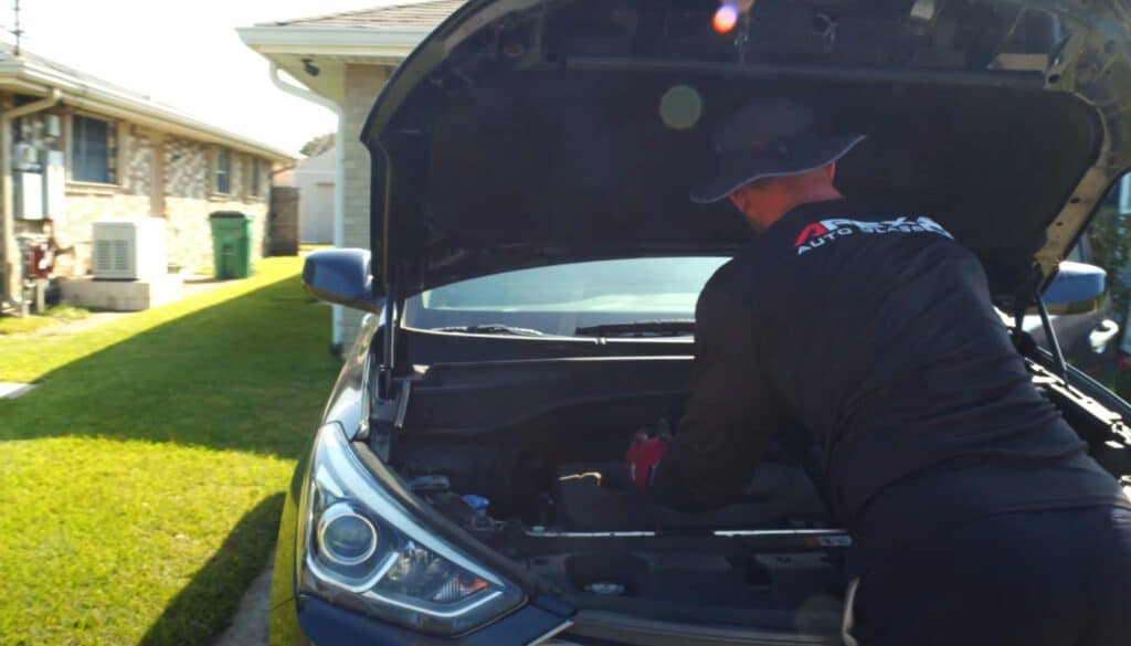 technician from apex auto glass in New Orleans, doing recalibration in New Orleans, Kenner.